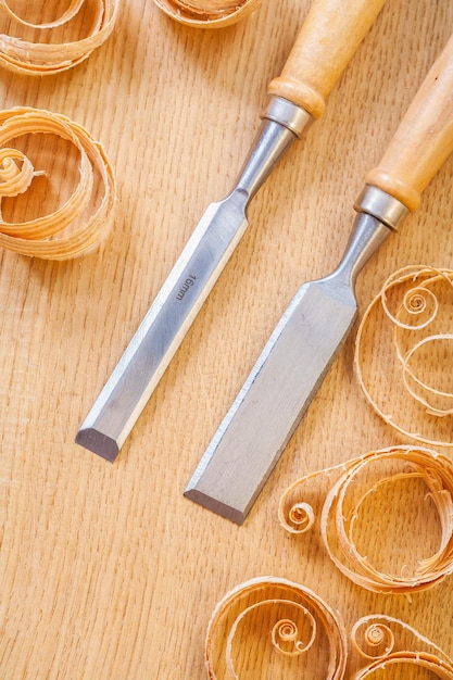 Chisels on wooden boards and chips