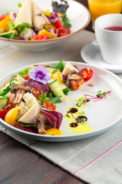 Chisken breast and mushroom salad with vegetables