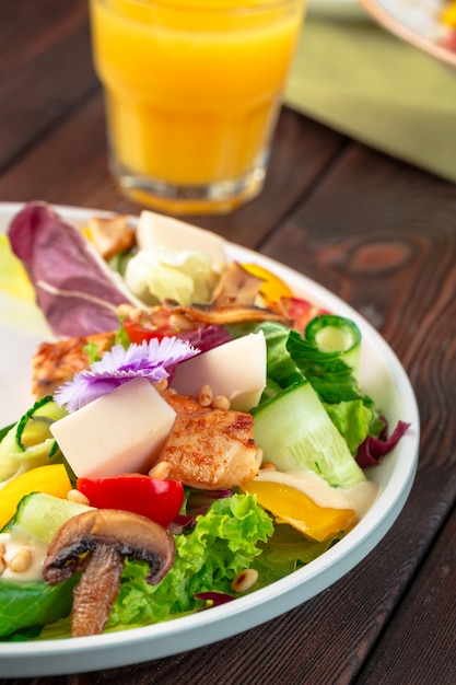 Chisken breast and mushroom salad with vegetables
