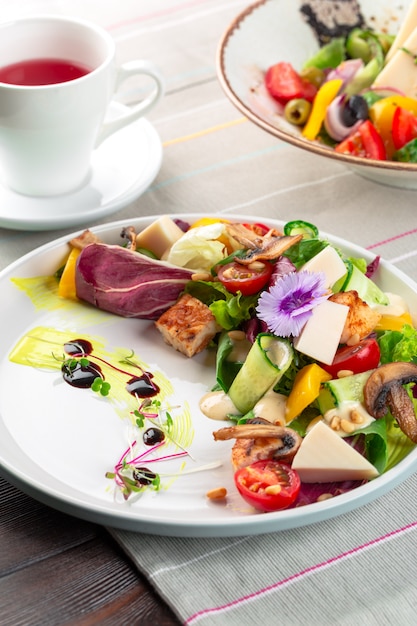 Chisken breast and mushroom salad with vegetables