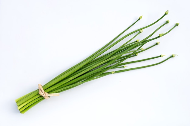 Chives flower or Chinese Chive on white surface