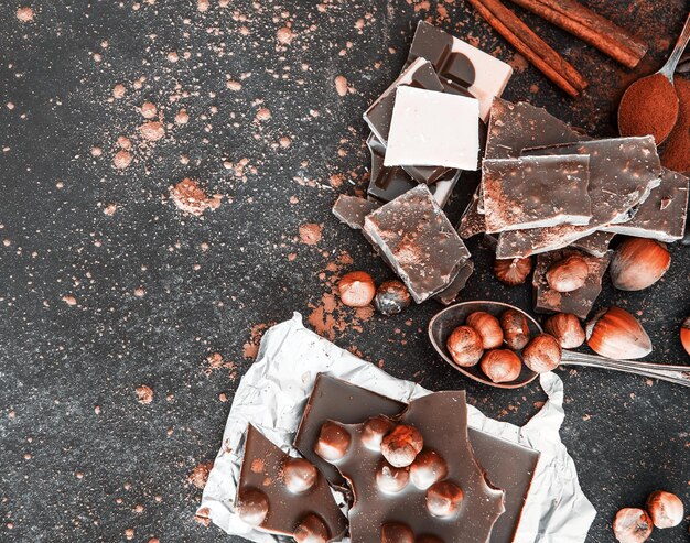 Chocolat and spices on black table