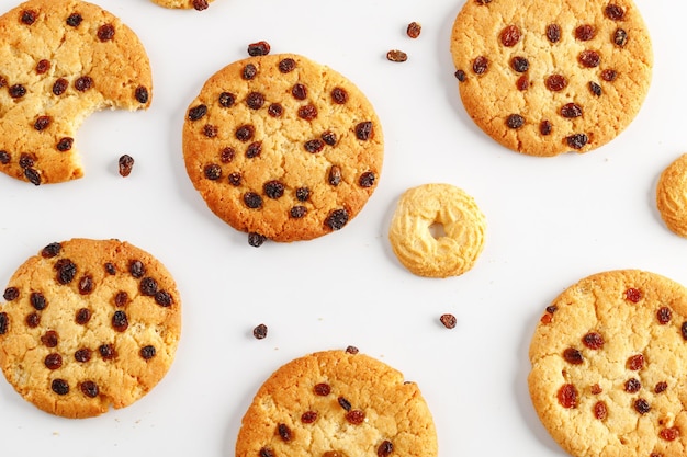 Chocolate american cookies with chocolate chips and raisins on white wooden table Top view flat lay