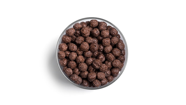 分離されたガラス瓶のチョコレートボール。簡単な朝食。