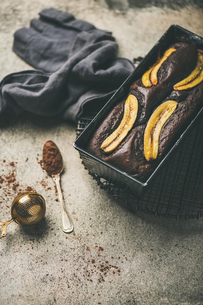 Chocolate banana cake with cinnamon in baking tin selective focus