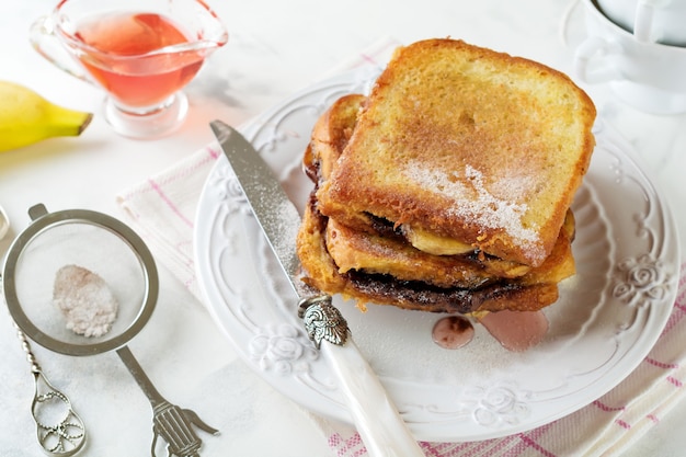 Chocolate banana french toast on a light.