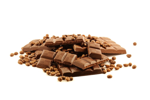 Chocolate bars and coffee beans on white