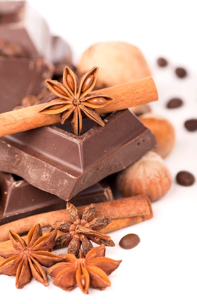 Chocolate bars with its ingredients isolated on white background