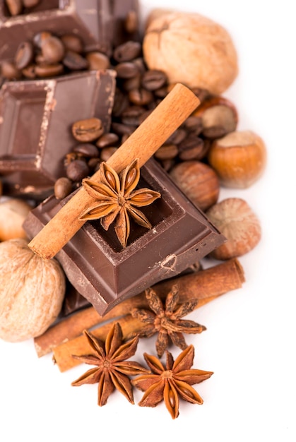 Chocolate bars with its ingredients isolated on white background