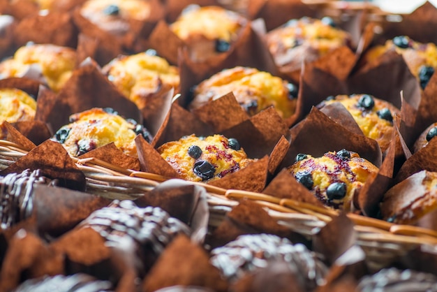 Chocolate and berry cupcakes in a basket on the bakery window