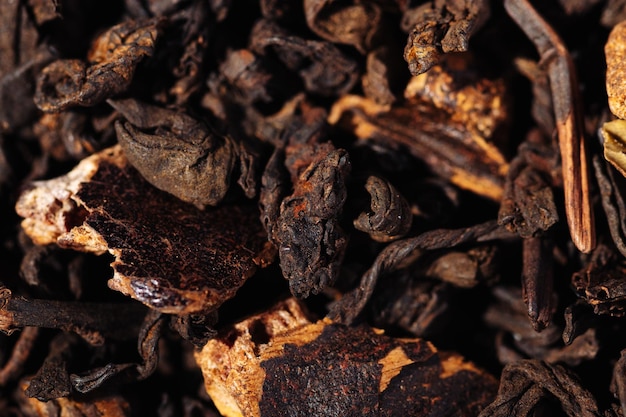 Chocolate black leaf shu puerh tea with cocoa beans closeup macro photography