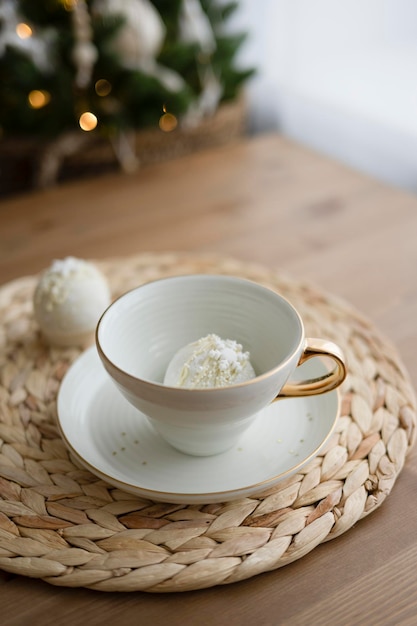 Chocolate bomb for milk drink in a white cup