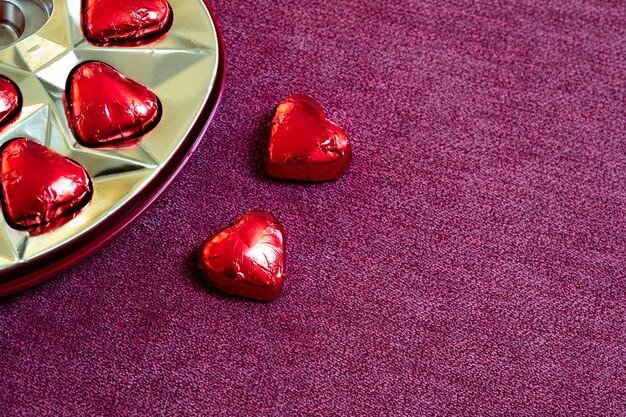 chocolate box with two heartshaped chocolates out of the box valentines day