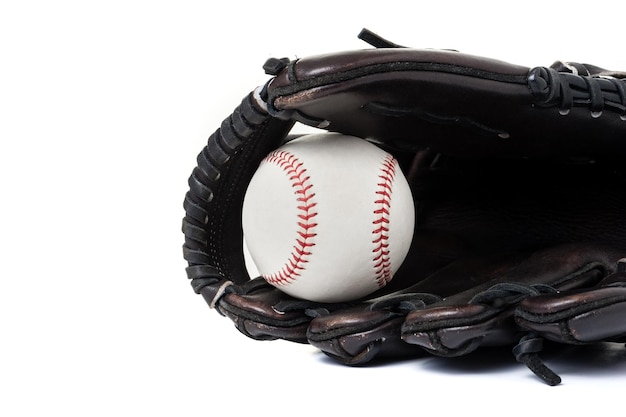 Chocolate brown baseball glove with the ball isolated over white background