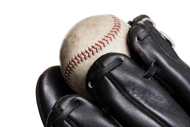 Chocolate brown baseball glove with the ball isolated over white background