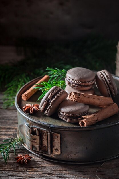 Chocolate and brown macaroons flavored with cinnamon for Christmas