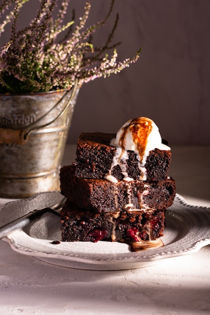 Chocolate brownie with cherry and vanilla ice cream