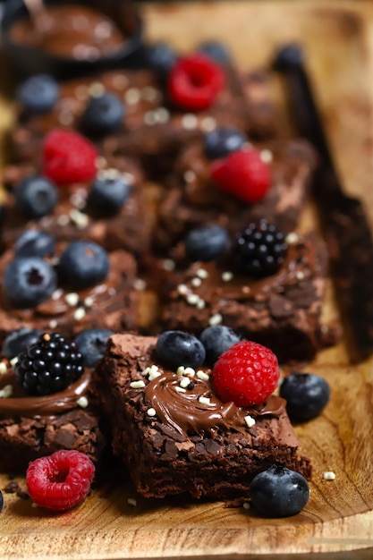 Chocolate brownies with hazelnut cream and berries