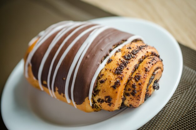 Chocolate bun with poppy seeds