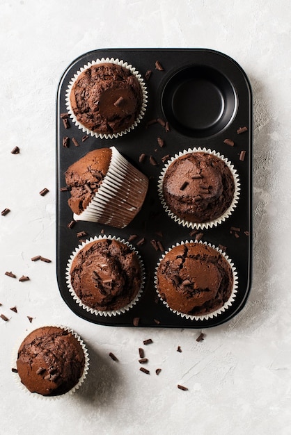 Chocolate cacao muffins flat lay with sprinkles