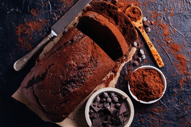 Chocolate cake cut with pieces of chocolate