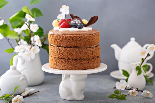 Photo chocolate cake for mothers day with berries and chocolate topping