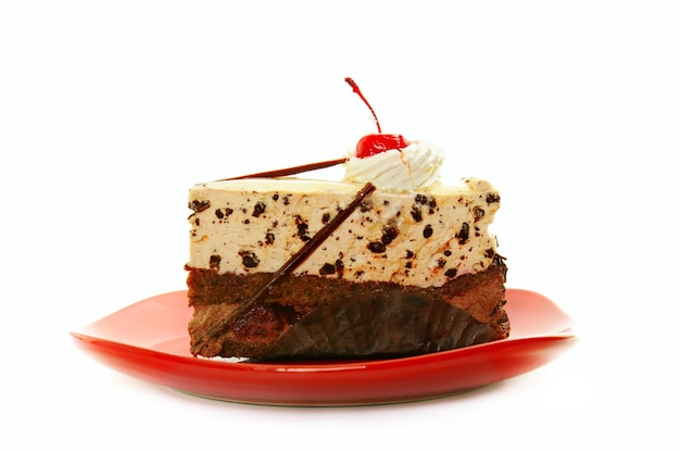 Chocolate cake on red dish