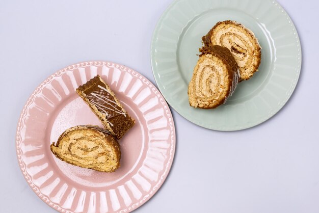 Chocolate Cake Roll Pieces of Chocolate Dessert on Plate Top View Horizontal