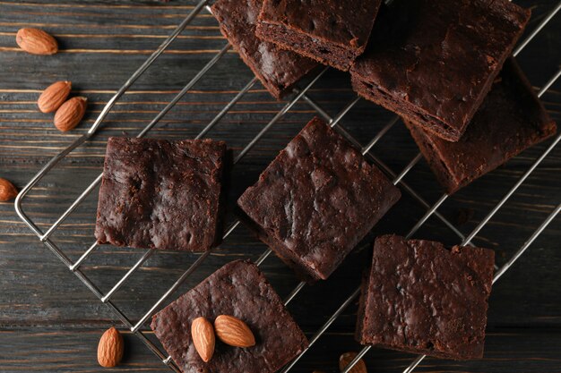 Chocolate cake slices and almond on wooden, top view