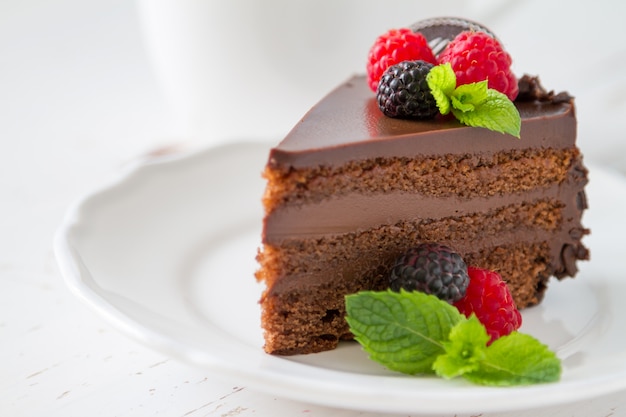 Chocolate cake on white plate