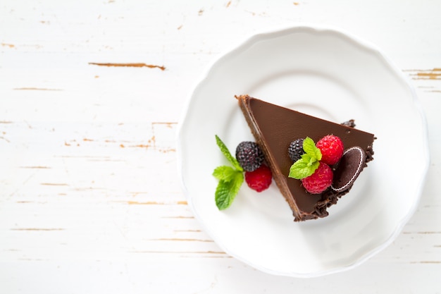 Chocolate cake on white plate