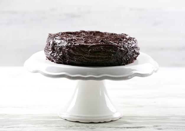 Chocolate cake on white wooden table