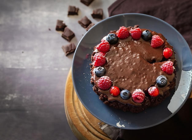 Chocolate cake with berries and copy space