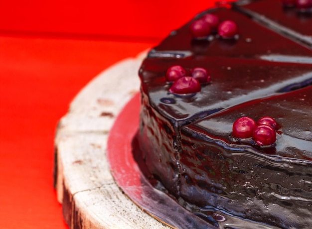 Chocolate cake with cream and currants