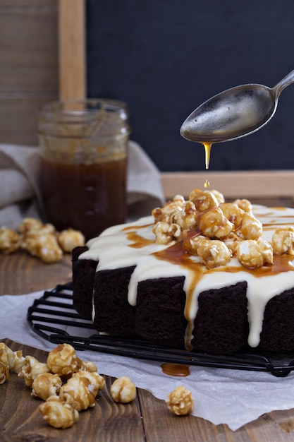 Chocolate cake with cream glaze and caramel