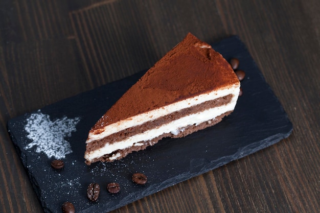 Chocolate cake with cream layers, close up