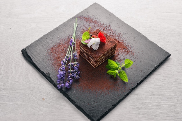 Chocolate cake with fresh berries On a wooden background Top review Free space