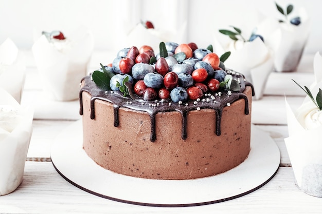 Chocolate cake with muffins and berries