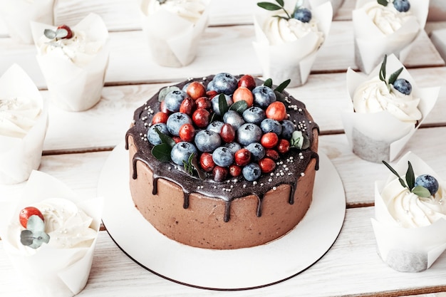 Chocolate cake with muffins and berries