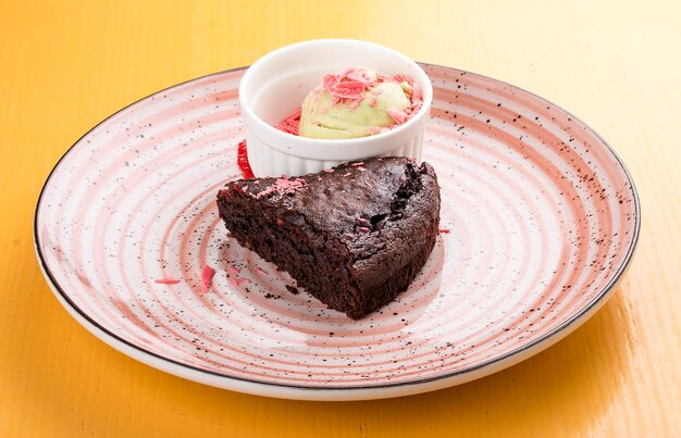 Chocolate cake with pistachio ice cream