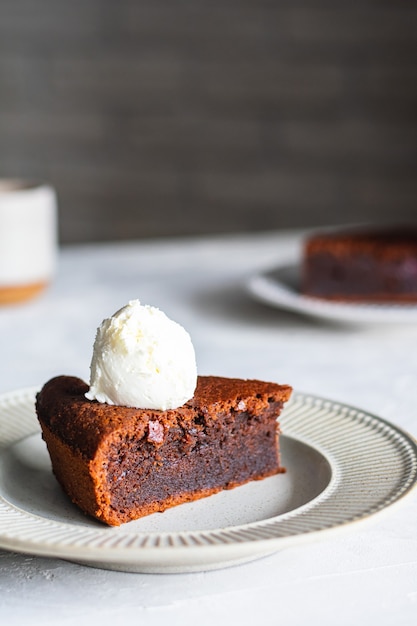 Chocolate cake with vanilla ice cream on a plate