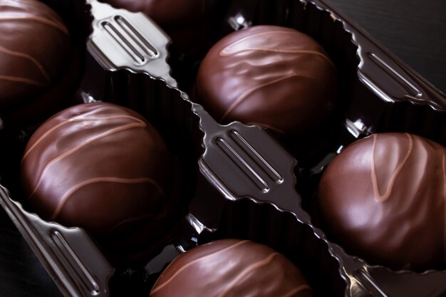 Chocolate candies in a box close up