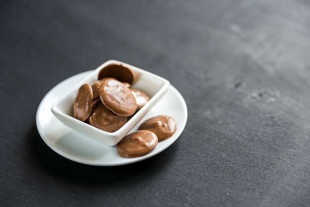 Chocolate candies in porcelain bowl