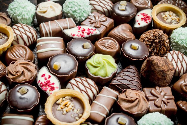 Photo chocolate candies with nuts and various fillings