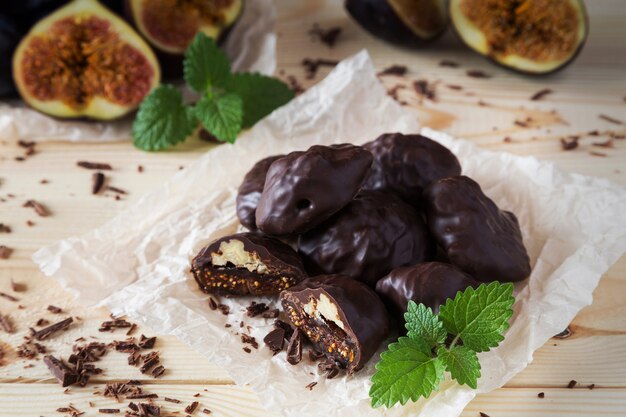 Chocolate candies with walnuts and figs