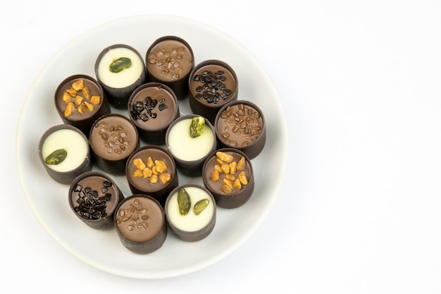 Chocolate candy on a white plate.