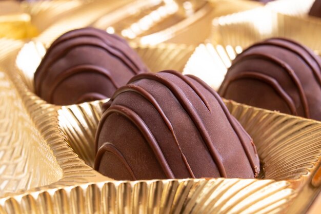 Chocolate candy in a yellow box closeup