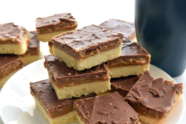 Chocolate caramel or Millionaires shortbread on a white plate