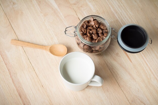 Chocolate cereal cornflakes and milk for breafast