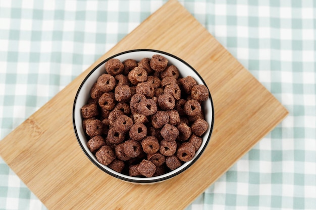 Photo chocolate cereal ring on ceramic bowl